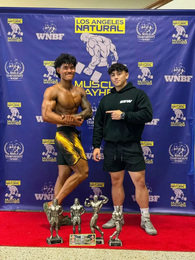 Limitless athlete at WNBF Los Angeles Natural with multiple trophies